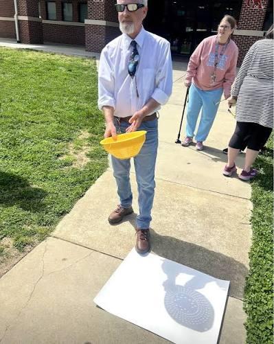 During a solar eclipse, most people look up at the sky—but one of ...